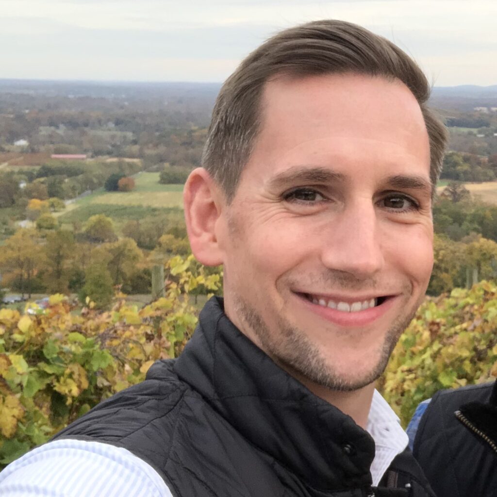 Blake Jones at Bluemont Vineyard in Bluemont, Virginia. Fall colors are seen appearing in the valley below.